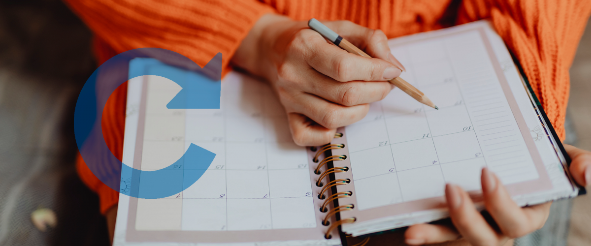 Woman writing down notes in her calendar